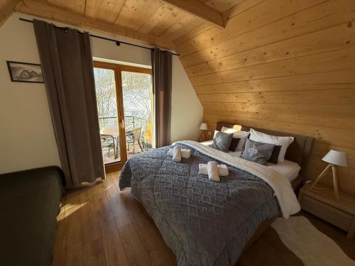 Postel nebo postele na pokoji v ubytování Domki w Białce pod Kotelnicą