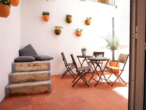 a dining room with a table and chairs at Combro by Patio 25 in Lisbon