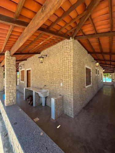a large brick building with a table in the middle at Oásis House in Macau