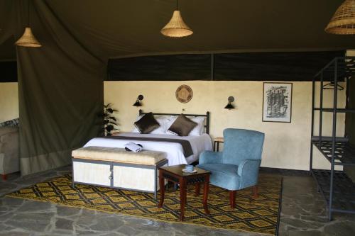 Ένα ή περισσότερα κρεβάτια σε δωμάτιο στο River Edge Lodge Masai Mara, Talek