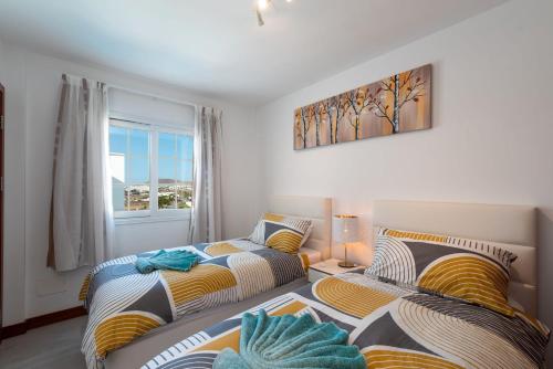 En eller flere senge i et værelse på Casa Deleil