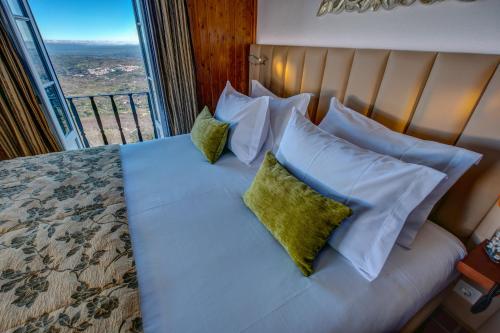 Una cama o camas en una habitación de Hotel El Rei Dom Manuel