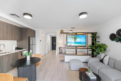 a living room with a couch and a table at High-Rise Luxury Condo in Downtown Miami in Miami