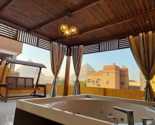 Imagine din galeria proprietății TuT Pyramids View în Cairo