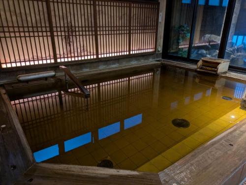 a swimming pool in a building with at Onyado Nono Toyama Natural Hot Spring in Toyama