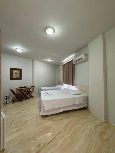 Ένα ή περισσότερα κρεβάτια σε δωμάτιο στο Hotel Pousada Figueiredo