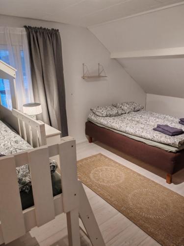 Ένα ή περισσότερα κρεβάτια σε δωμάτιο στο Villa Kauliranta - cozy home in Lapland