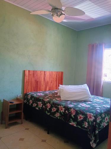 En eller flere senge i et værelse på Paúba House