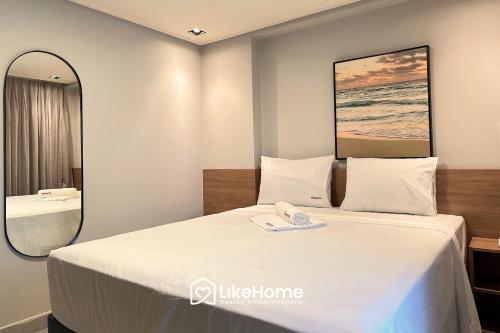 Ένα ή περισσότερα κρεβάτια σε δωμάτιο στο Hit Cabo Branco - LikeHome Hospedagens