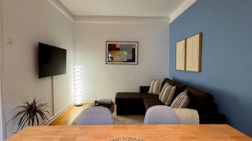 a living room with a couch and a table at WHome Charming & Stylish Apartment in Benfica in Lisbon