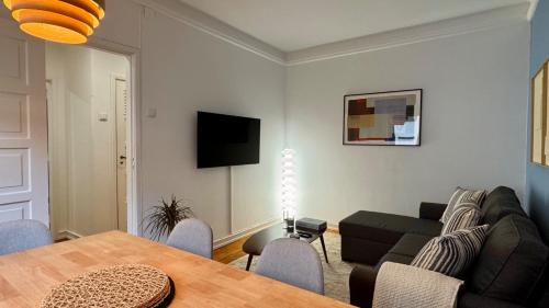 a living room with a couch and a table at WHome Charming & Stylish Apartment in Benfica in Lisbon
