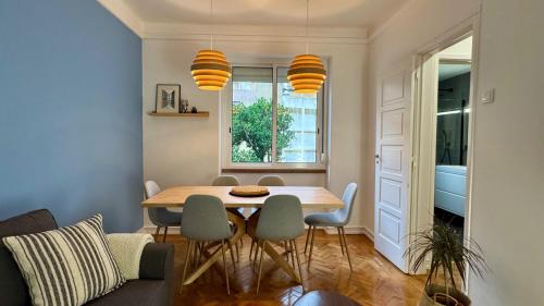 a dining room with a table and chairs at WHome Charming & Stylish Apartment in Benfica in Lisbon