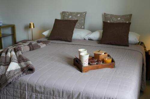 a bed with a tray of donuts and candles on it at Marisella holidays house in Pozzuoli
