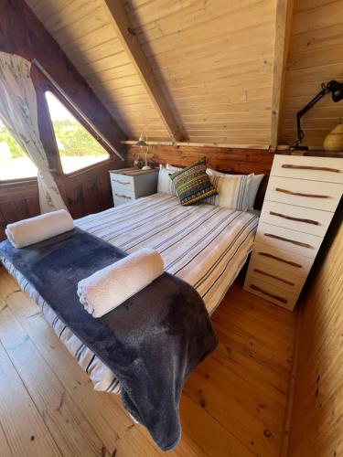 Ένα ή περισσότερα κρεβάτια σε δωμάτιο στο Plett Candlewood Tiny House