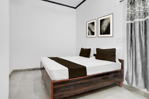 Ένα ή περισσότερα κρεβάτια σε δωμάτιο στο Hotel O Shubh Residency