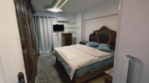 Ένα ή περισσότερα κρεβάτια σε δωμάτιο στο Giza City Hotel-الجيزة سيتى اوتيل