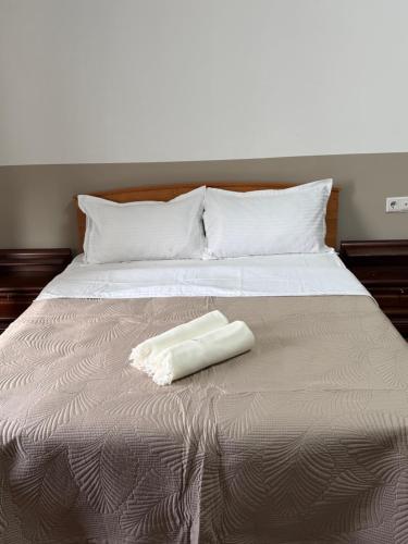 Ένα ή περισσότερα κρεβάτια σε δωμάτιο στο Номера в уютном отеле Sofia-Promenade