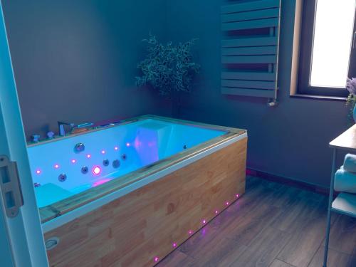 a hot tub in the corner of a room at Urban Deluxe Calea Victoriei 100 Sauna and Jacuzzi in Bucharest