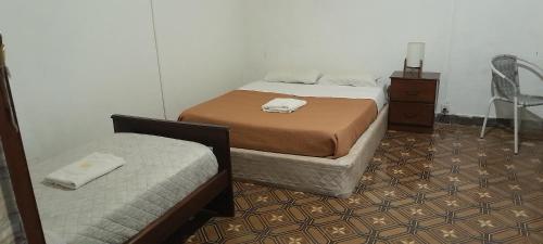 Postel nebo postele na pokoji v ubytování Atardecer en el Río