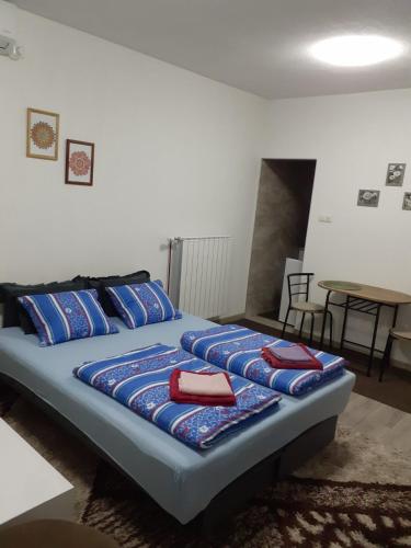 Un pat sau paturi într-o cameră la Irma