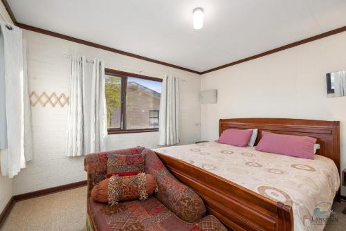 Ένα ή περισσότερα κρεβάτια σε δωμάτιο στο Double View