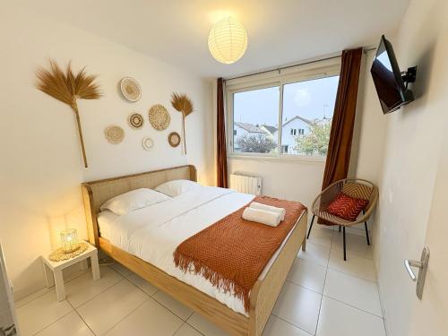 Una cama o camas en una habitación de Suite Savanna by Escale-Marne - 102