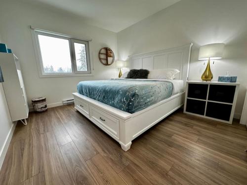 a dog laying on a bed in a bedroom at Golden Moments in Golden