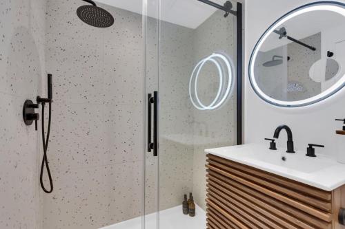 a bathroom with a shower and a sink at The Speakeasy Suite 502 With Parking in Montreal
