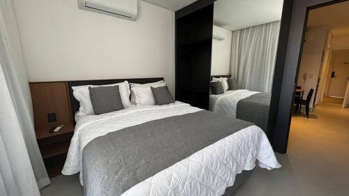 Ένα ή περισσότερα κρεβάτια σε δωμάτιο στο Porto 2 Life - Apartmento em Muro Alto