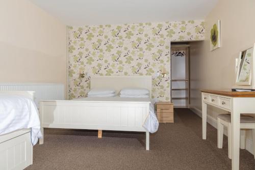 Ένα ή περισσότερα κρεβάτια σε δωμάτιο στο Whitton Lodge B&B