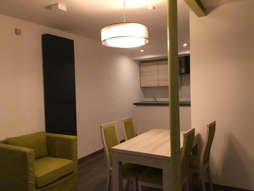 a kitchen and dining room with a table and chairs at Hotel Fürsteneck in Bernburg