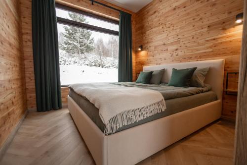 Ένα ή περισσότερα κρεβάτια σε δωμάτιο στο Яблуневий схил