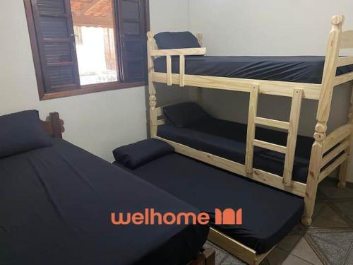 Postel nebo postele na pokoji v ubytování Sitio em Aracariguama com Piscina e Churrasqueira