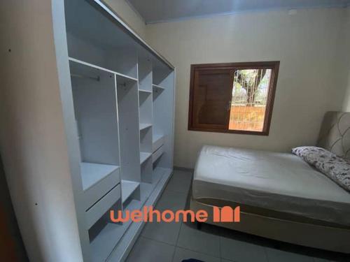 Postel nebo postele na pokoji v ubytování Sitio em Aracariguama com Piscina e Churrasqueira