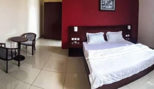 Ένα ή περισσότερα κρεβάτια σε δωμάτιο στο Hampton Resorts