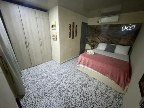 Ένα ή περισσότερα κρεβάτια σε δωμάτιο στο Casa Rodadero