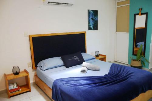 Ένα ή περισσότερα κρεβάτια σε δωμάτιο στο Studios Yaxkin, located in downtown