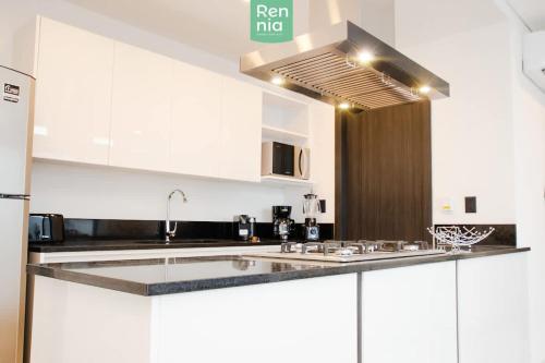 Η κουζίνα ή μικρή κουζίνα στο LOFT 2 Hab Sofa Cama AC 2 Parking