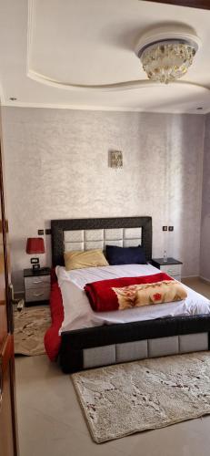 a bedroom with a large bed in a room at Villa in Meknès