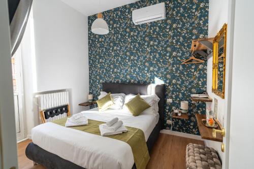 Ένα ή περισσότερα κρεβάτια σε δωμάτιο στο NOI Luxury rooms Colosseum