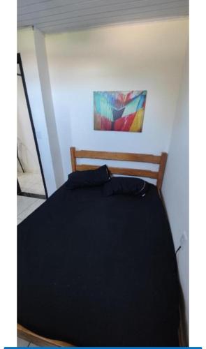 Ένα ή περισσότερα κρεβάτια σε δωμάτιο στο Kitnet 2