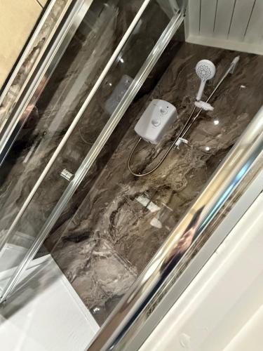 a bathroom floor with a dirty floor at Harbour Lights Retreat-Small and Cosy 1 bedroom in Ferryden