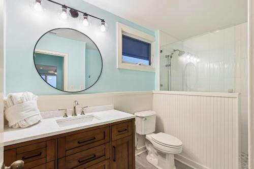 a bathroom with a sink and a toilet and a mirror at SG3C: 3C Seagrove Villa in Isle of Palms