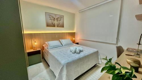 Ένα ή περισσότερα κρεβάτια σε δωμάτιο στο Alto Padrão e Tranquilidade no Litorial Norte