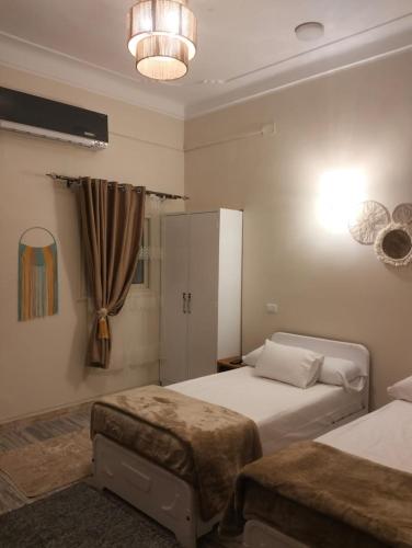 Ένα ή περισσότερα κρεβάτια σε δωμάτιο στο Wonji house