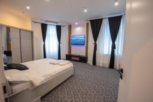 Postel nebo postele na pokoji v ubytování Vibe90 apartament centru istoric