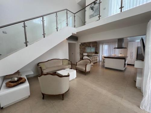 a living room with a staircase and a living room at Condo cozy 1bdr 1bth in Punta Cana