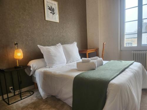 Postel nebo postele na pokoji v ubytování hôtel et restaurant les2M