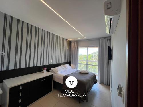 En eller flere senge i et værelse på Nautilus Refúgio da Alegria - Penha/SC