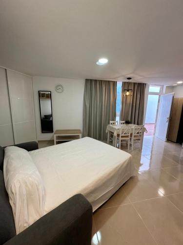 Postel nebo postele na pokoji v ubytování Apartamento Studio Anau k&L